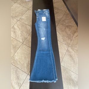 Distressed Flare Medium Wash Jeans size 9(28). High rise fit with a fringe hem.